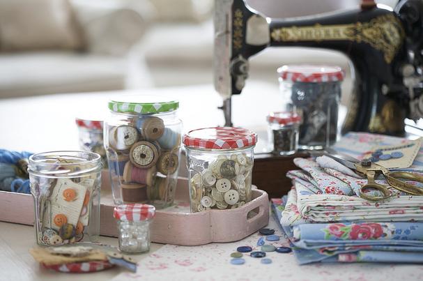 Recycled jam jars for holding sewing supplies