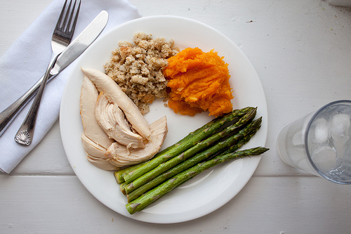 chicken dinner with squash, stuffing, asparagus