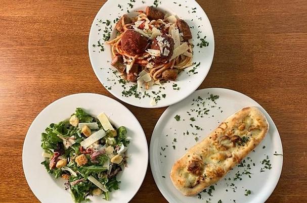 Spaghetti and meatballs with salad and garlic bread 