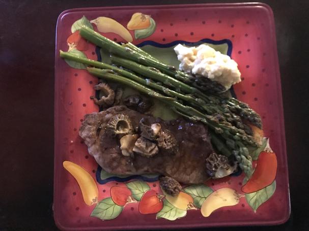 Steak with morel mushrooms and asparagus